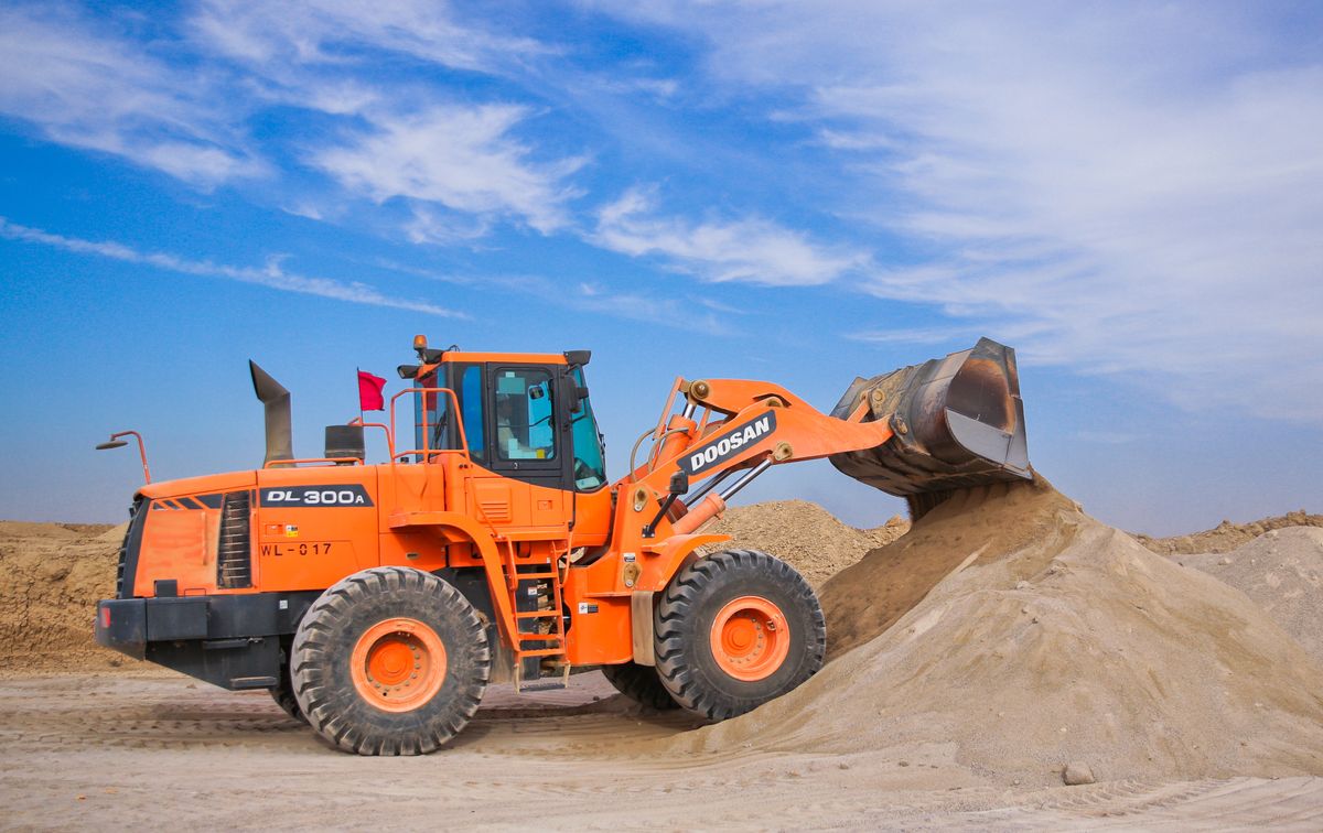 Equipment loader on a business worksite